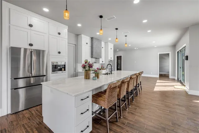 a kitchen with a sink and large window