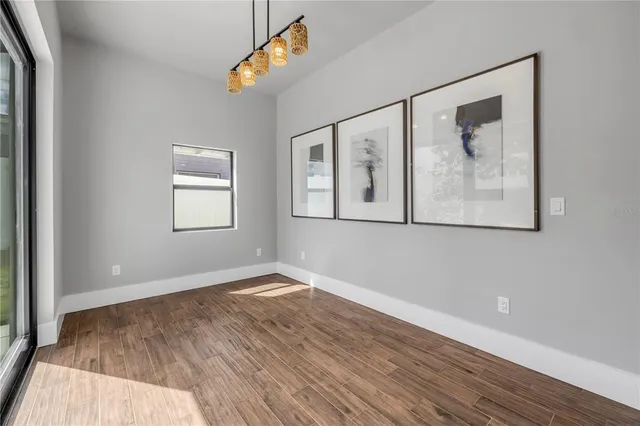a bathroom with double vanity sinks and a mirror