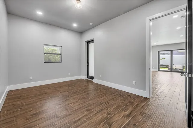 a view of a backyard with wooden fence