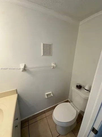 a bathroom with a toilet and a sink