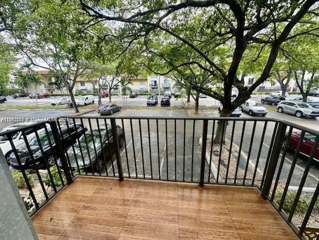 8600 Southwest 109th Avenue, Unit 4216 Miami, FL 33173 - Photo 7 of 20 a view of a pathway of a wrought iron deck