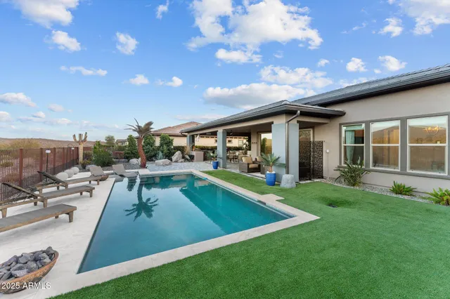 a view of a house couches and a backyard