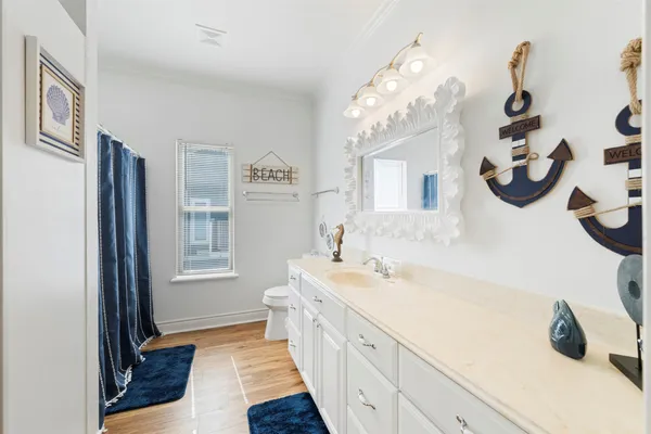 a spacious bathroom with a double vanity sink and a mirror