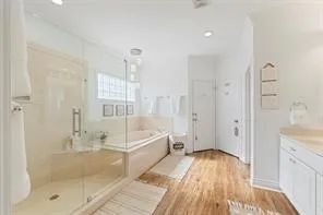 a bathroom with a bathtub and a shower