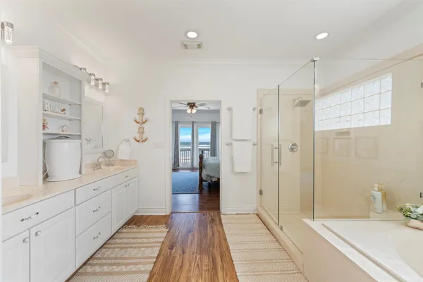 a bathroom with a granite countertop sink a toilet and a mirror