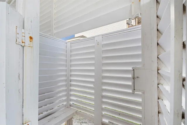 a view of a big house with a big yard and large trees