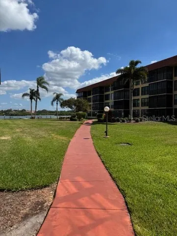 a view of a backyard with sitting area