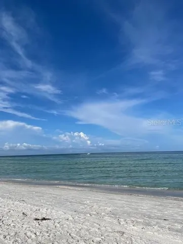 a view of beach and an ocean