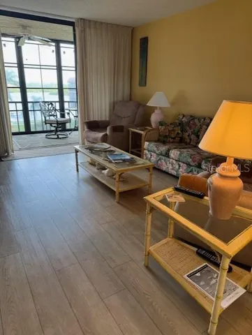 a living room with furniture and a table