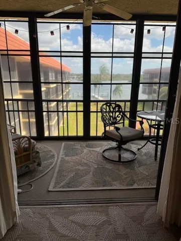 a view of a living room with furniture and window