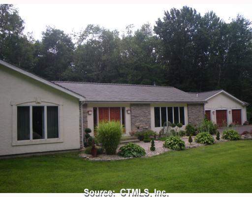 210 Valley Road Bethany, CT 06524 - Photo 1 of 1 a view of a house with a yard and potted plants