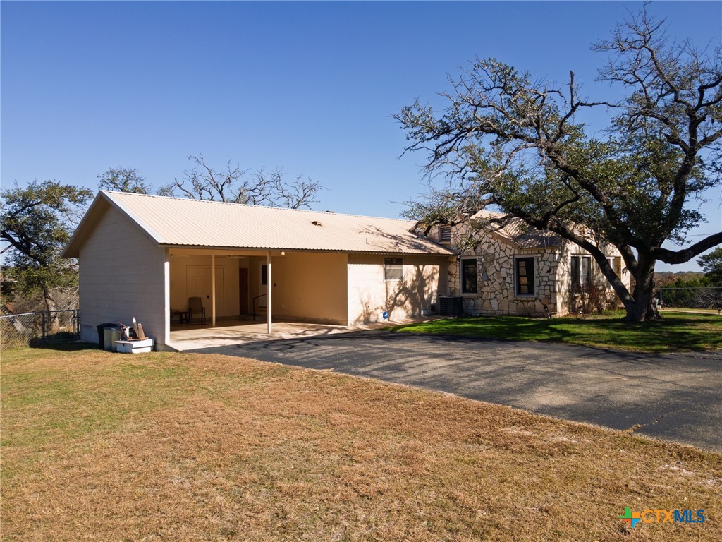 1003 North Ridge Street Lampasas, TX 76550 - Photo 2 of 44 a view of a house with a yard and large tree