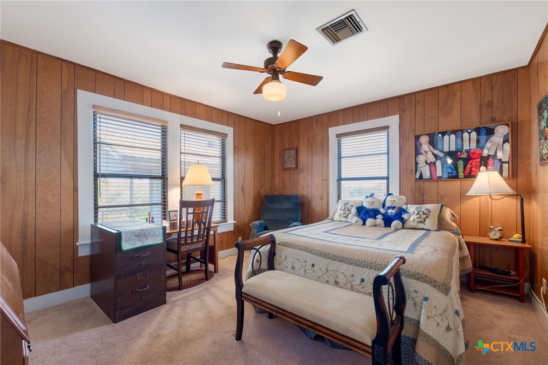 1003 North Ridge Street Lampasas, TX 76550 - Photo 21 of 44 a bedroom with a bed and wooden floor
