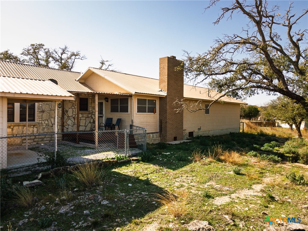 1003 North Ridge Street Lampasas, TX 76550 - Photo 31 of 44 a view of a house with backyard and sitting area