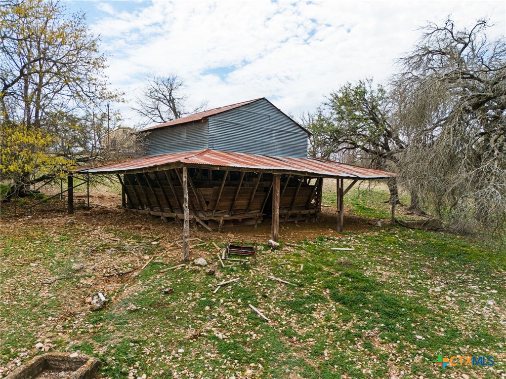 1003 North Ridge Street Lampasas, TX 76550 - Photo 38 of 44 a backyard of a house with table and chairs