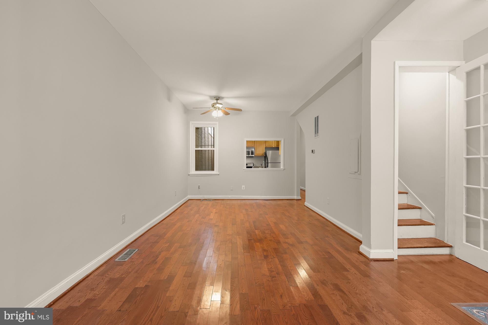 601 L Street Northeast Washington, DC 20002 - Photo 7 of 47 a view of an empty room with wooden floor and a window