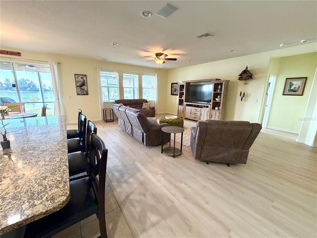 1516 Yale Castle Court Ruskin, FL 33570 - Photo 14 of 52 a living room with furniture and a flat screen tv