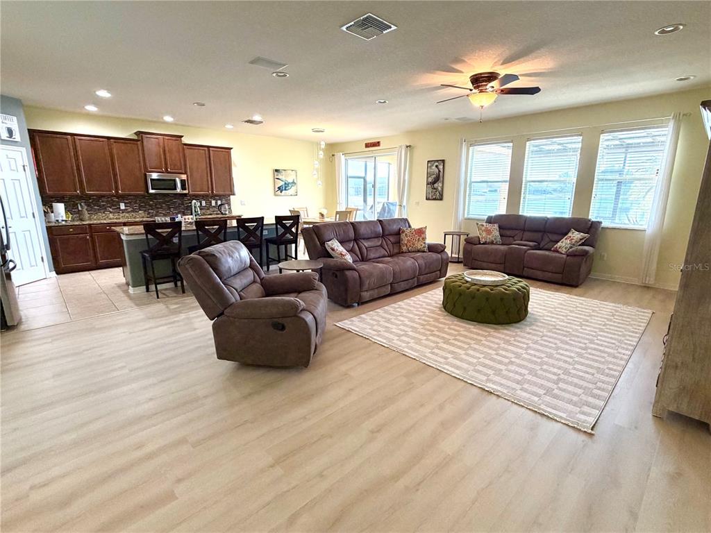 1516 Yale Castle Court Ruskin, FL 33570 - Photo 17 of 52 a living room with furniture kitchen and a wooden floor