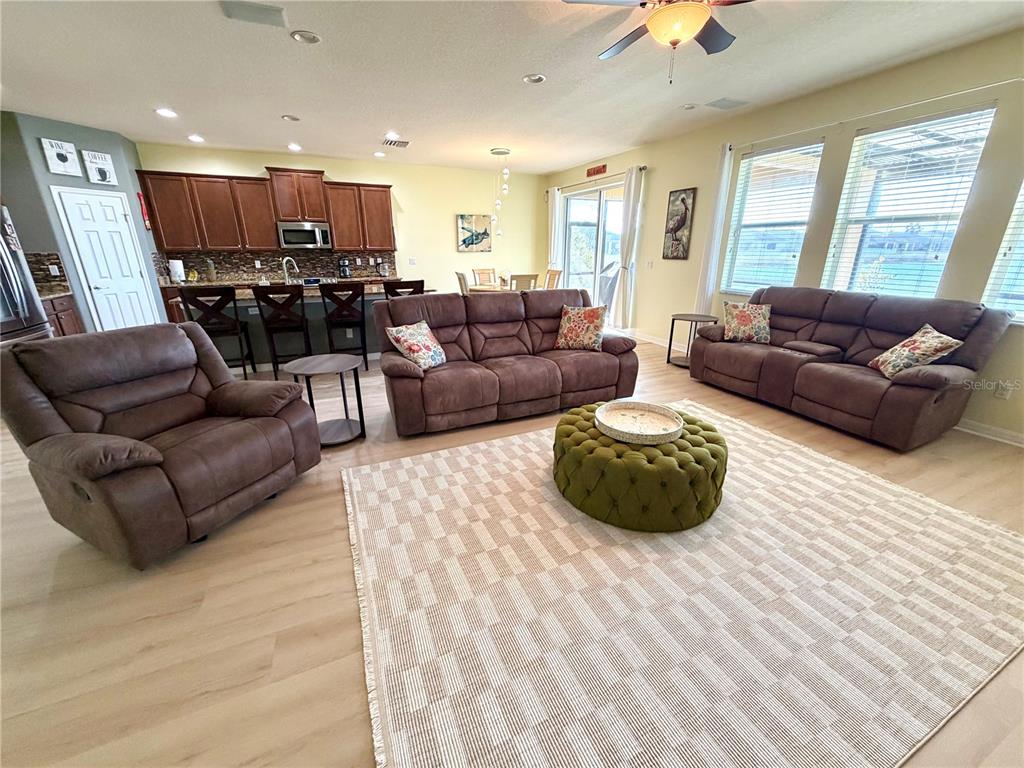 1516 Yale Castle Court Ruskin, FL 33570 - Photo 18 of 52 a living room with furniture and kitchen view