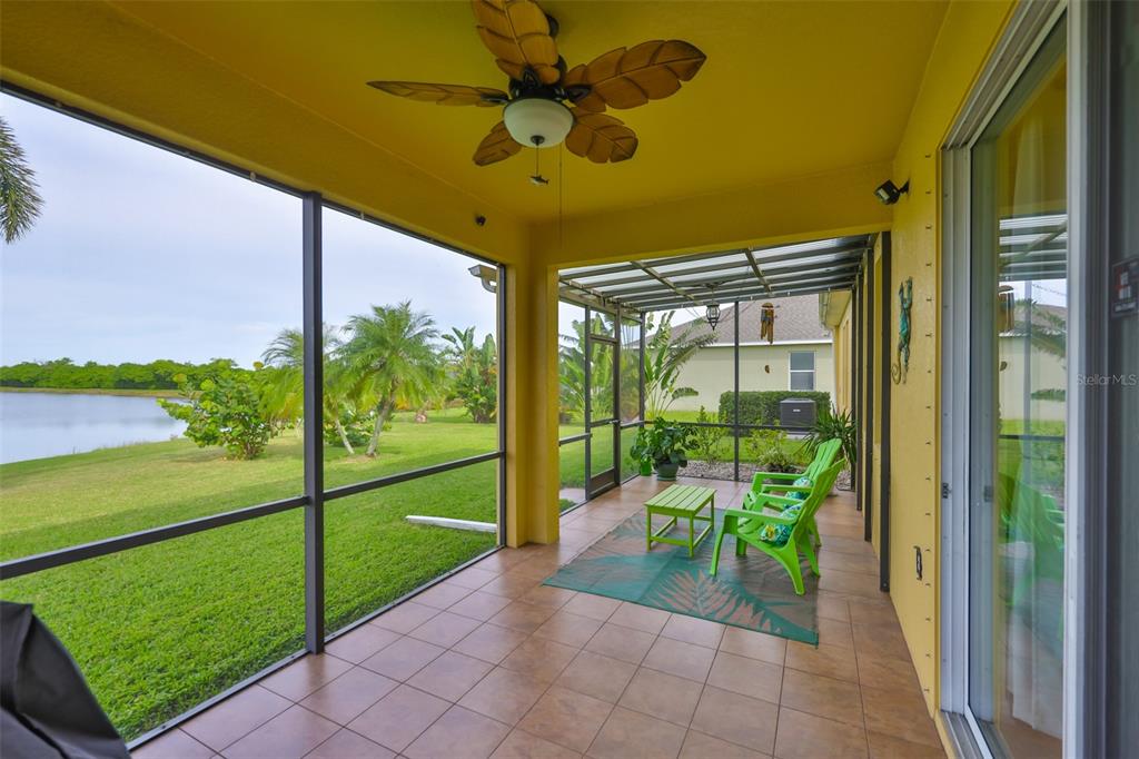 1516 Yale Castle Court Ruskin, FL 33570 - Photo 2 of 52 a porch with a table and chairs