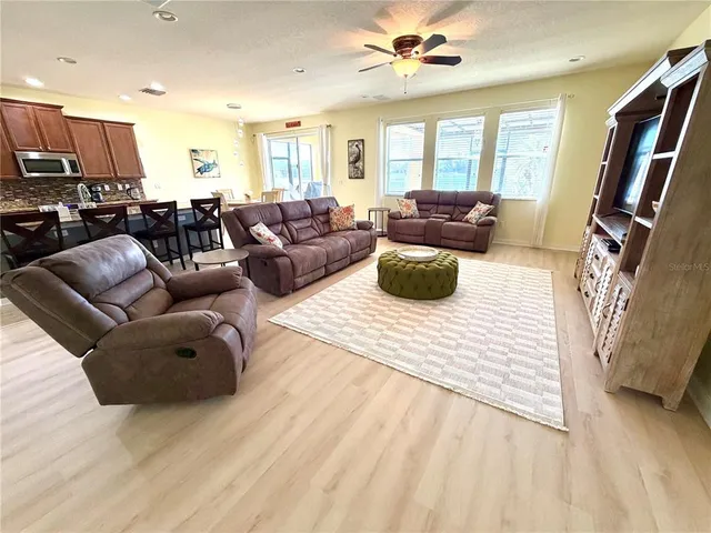 a room with gym equipment and windows