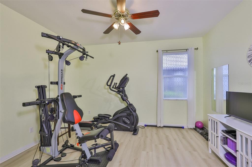 1516 Yale Castle Court Ruskin, FL 33570 - Photo 23 of 52 a room with gym equipment and windows