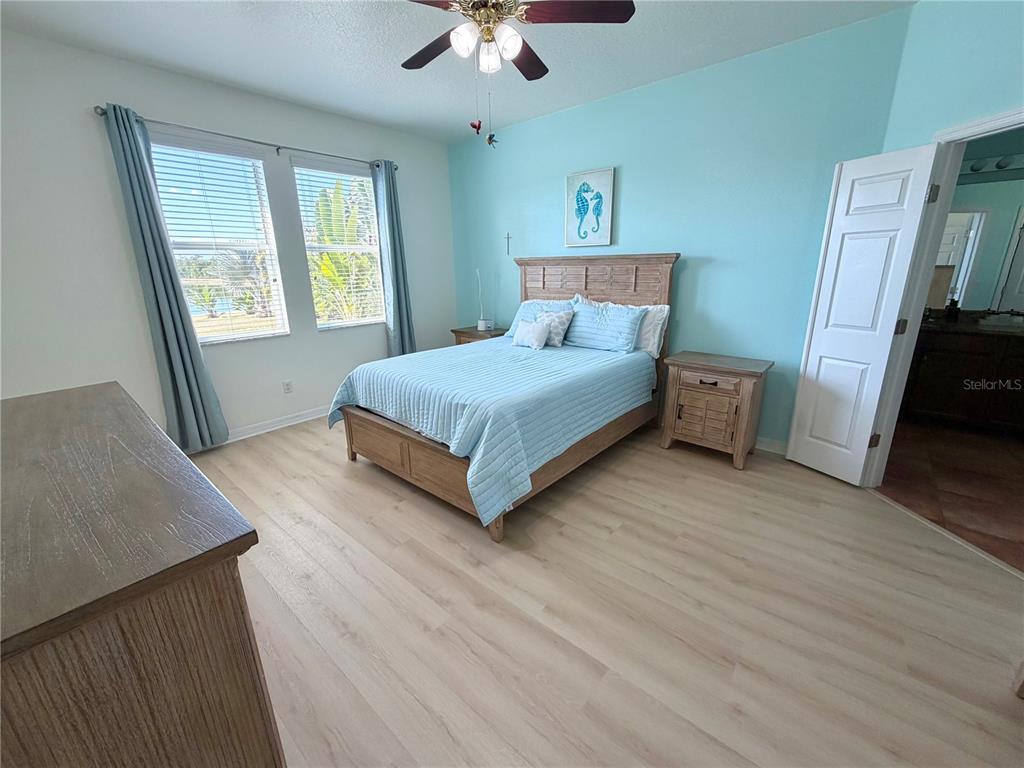 1516 Yale Castle Court Ruskin, FL 33570 - Photo 29 of 52 a bedroom with a bed dresser and a window