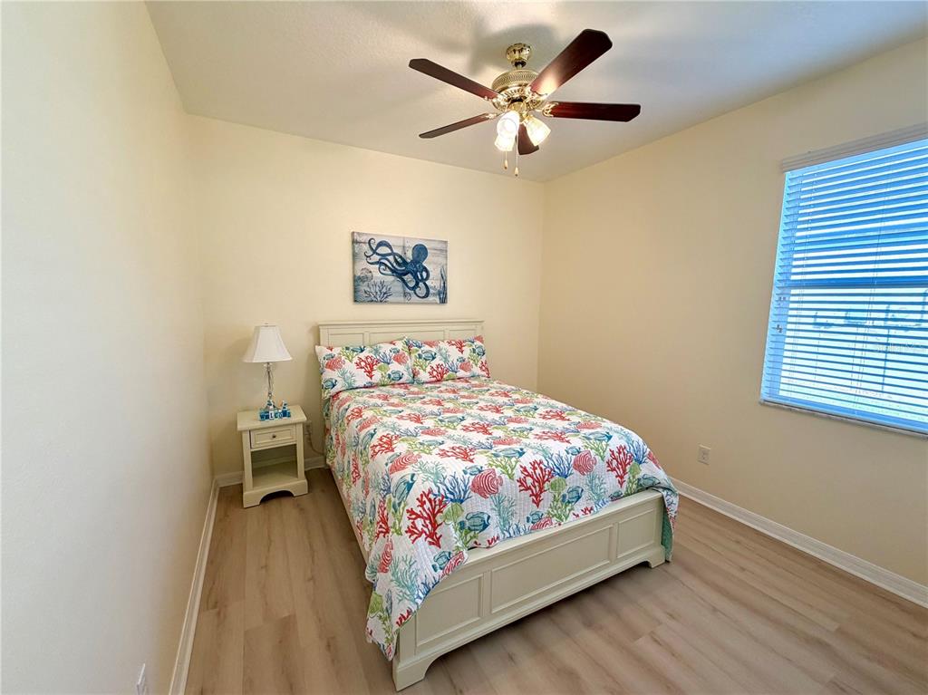 1516 Yale Castle Court Ruskin, FL 33570 - Photo 37 of 52 a bedroom with a bed and a painting on the wall