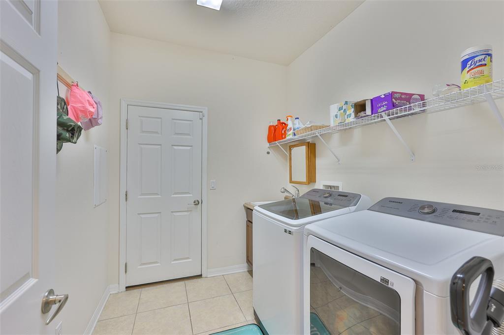 1516 Yale Castle Court Ruskin, FL 33570 - Photo 39 of 52 a utility room with sink dryer and washer