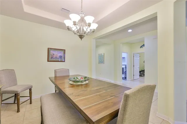 a living room with furniture fireplace and a table