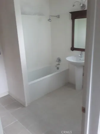 a bathroom with a bathtub sink and toilet