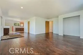 a view of livingroom with an empty space and a fireplace