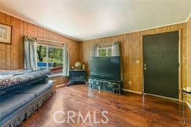 777 Morning Glory Road Mountain Ranch, CA 95246 - Photo 18 of 34 a living room with furniture and a flat screen tv
