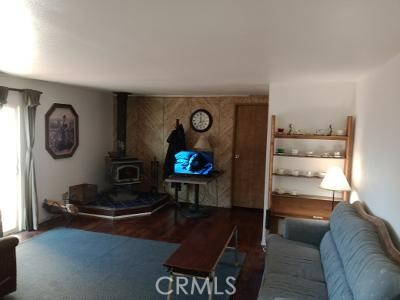 777 Morning Glory Road Mountain Ranch, CA 95246 - Photo 19 of 34 a living room with furniture a rug and a wall painting