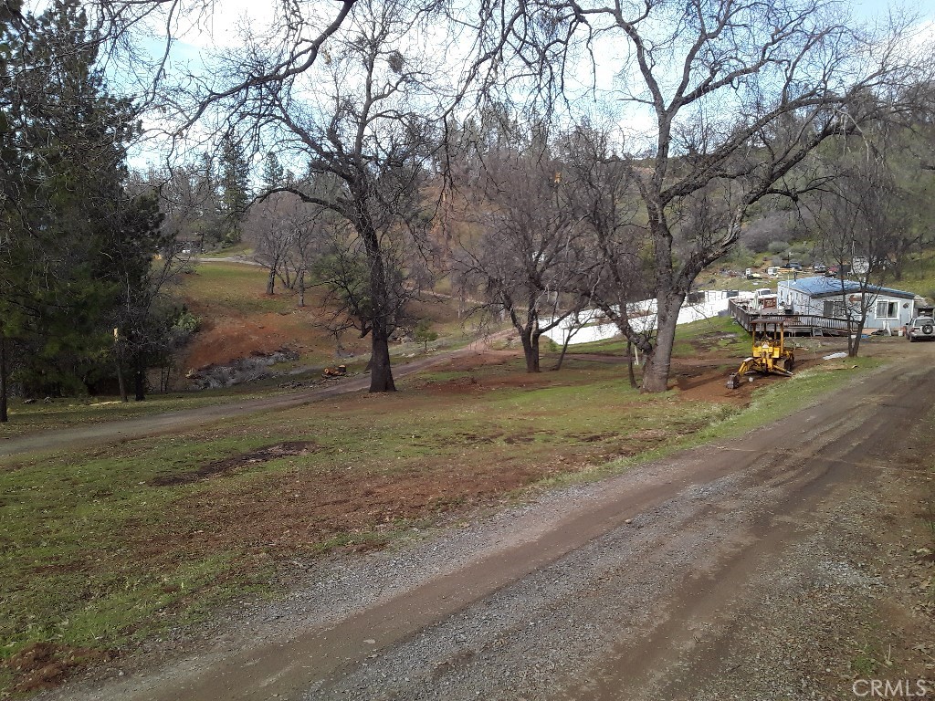 777 Morning Glory Road Mountain Ranch, CA 95246 - Photo 23 of 34 a view of dirt yard with a house