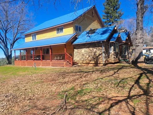 a view of a backyard with swimming pool