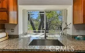 a kitchen with a sink and large window