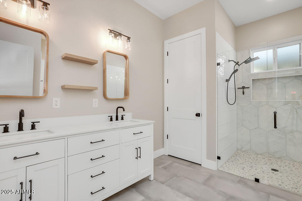 4102 East Pinchot Avenue Phoenix, AZ 85018 - Photo 13 of 28 a bathroom with a double vanity sink mirror and shower