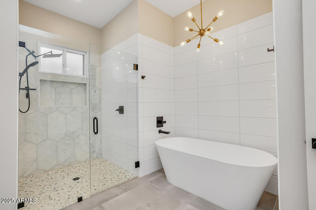 4102 East Pinchot Avenue Phoenix, AZ 85018 - Photo 14 of 28 a bathroom with a bathtub and shower
