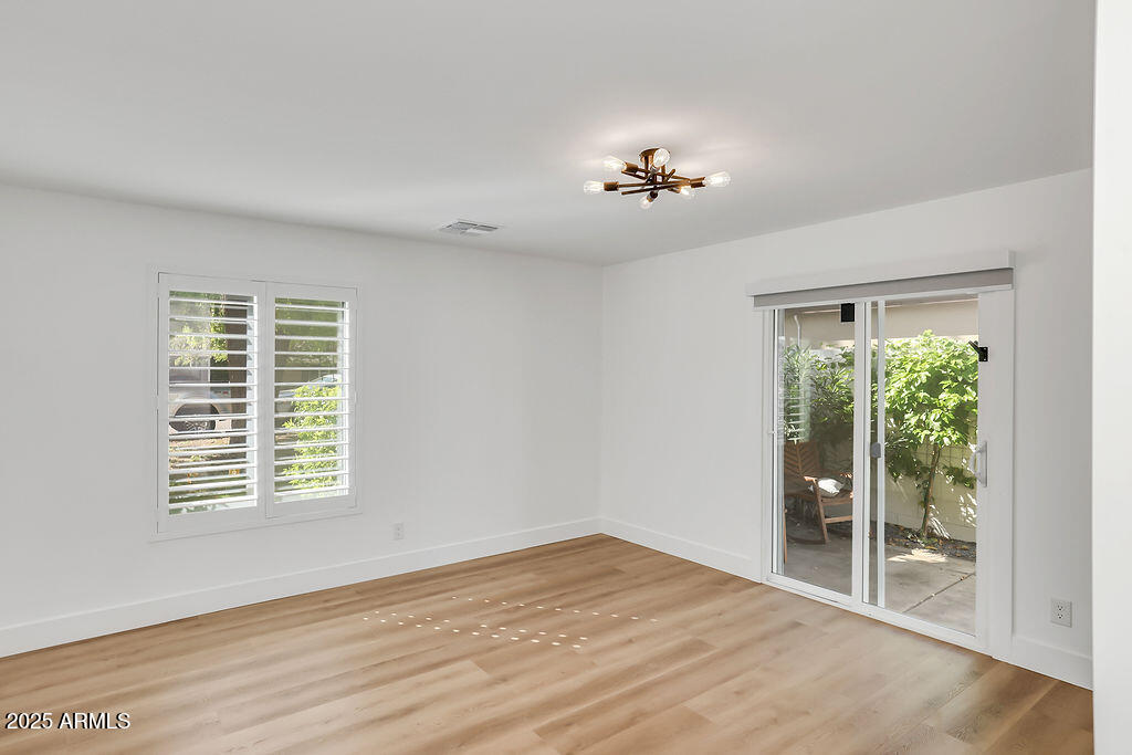 4102 East Pinchot Avenue Phoenix, AZ 85018 - Photo 18 of 28 a view of an empty room with a window