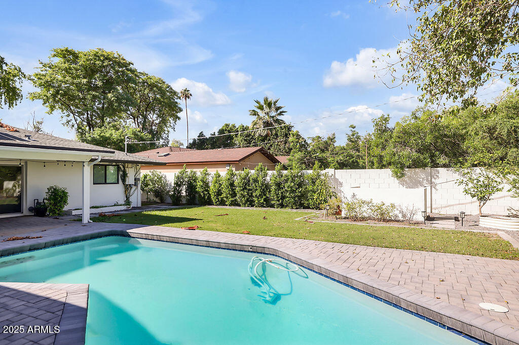 4102 East Pinchot Avenue Phoenix, AZ 85018 - Photo 24 of 28 a view of a house with a big yard and swimming pool