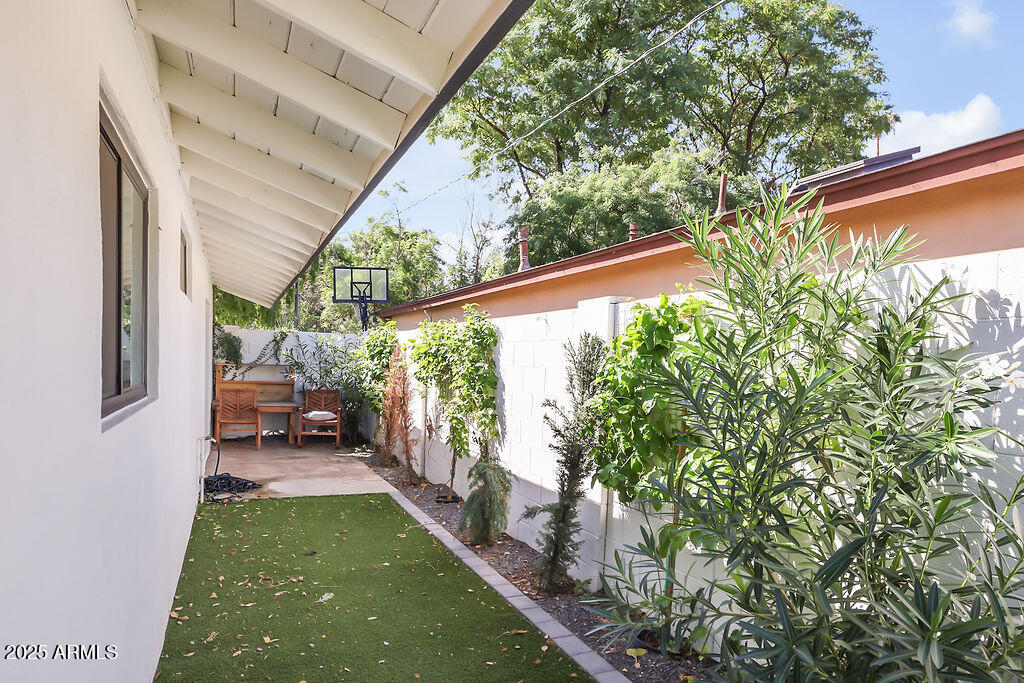 4102 East Pinchot Avenue Phoenix, AZ 85018 - Photo 27 of 28 a backyard of a house with outdoor seating