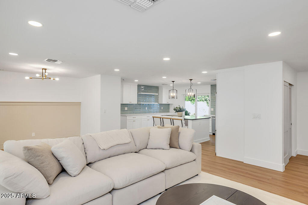 4102 East Pinchot Avenue Phoenix, AZ 85018 - Photo 9 of 28 a living room with furniture and kitchen view