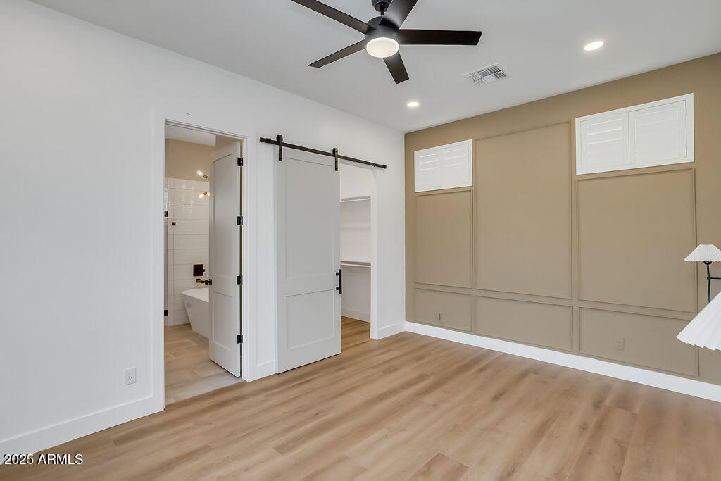 4102 East Pinchot Avenue Phoenix, AZ 85018 - Photo 10 of 28 a view of empty room with wooden floor
