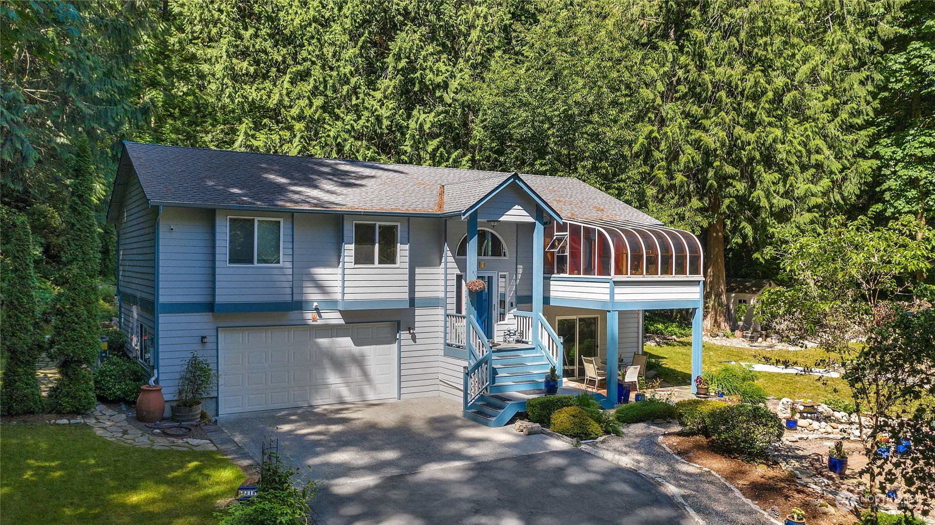 7118 Spada Road Snohomish, WA 98290 - Photo 1 of 1 a front view of a house with garden