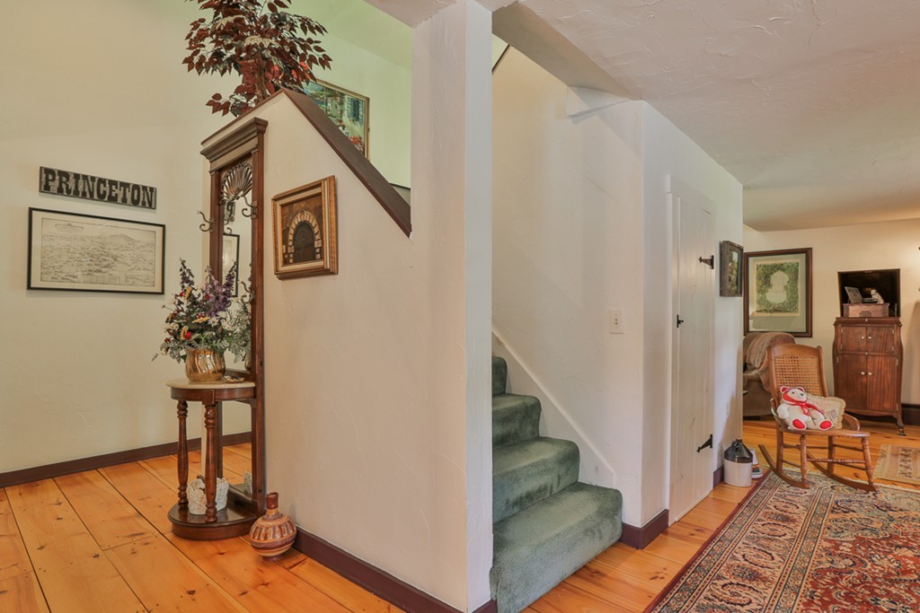 129 Gleason Road Princeton, MA 01541 - Photo 12 of 30 a view of a hallway with wooden floor and staircase