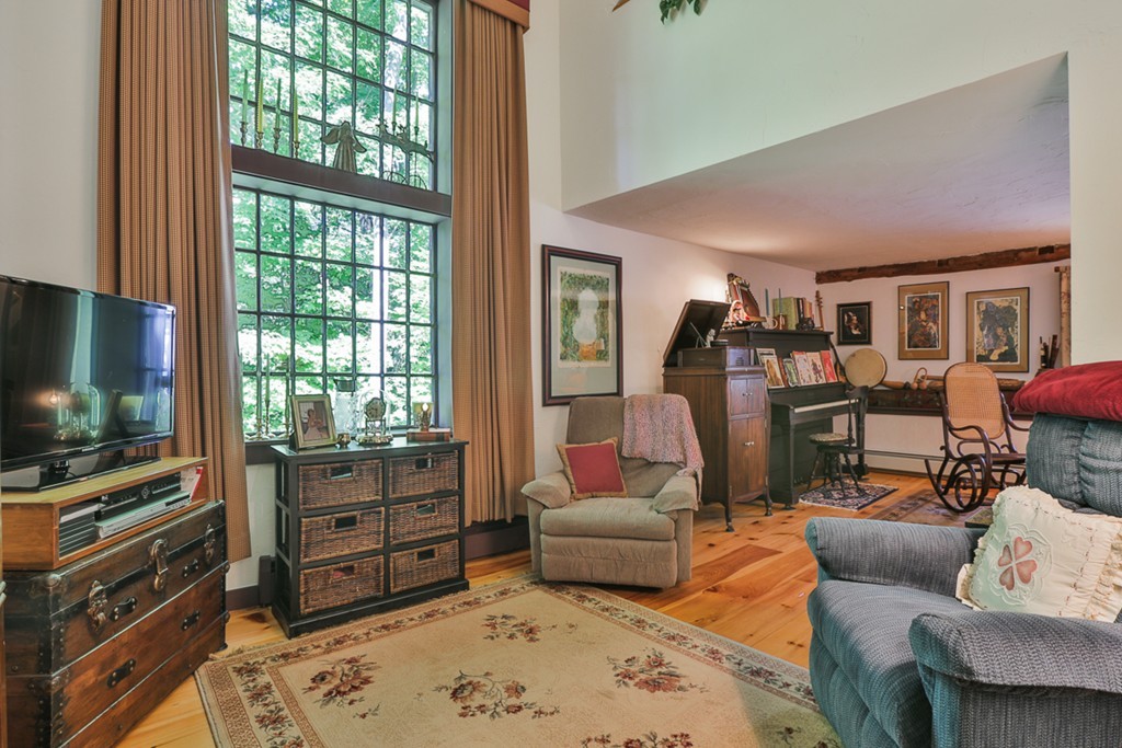 129 Gleason Road Princeton, MA 01541 - Photo 13 of 30 a living room with furniture and a flat screen tv