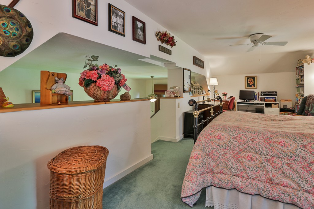 129 Gleason Road Princeton, MA 01541 - Photo 16 of 30 a bed room with a bed and a couch