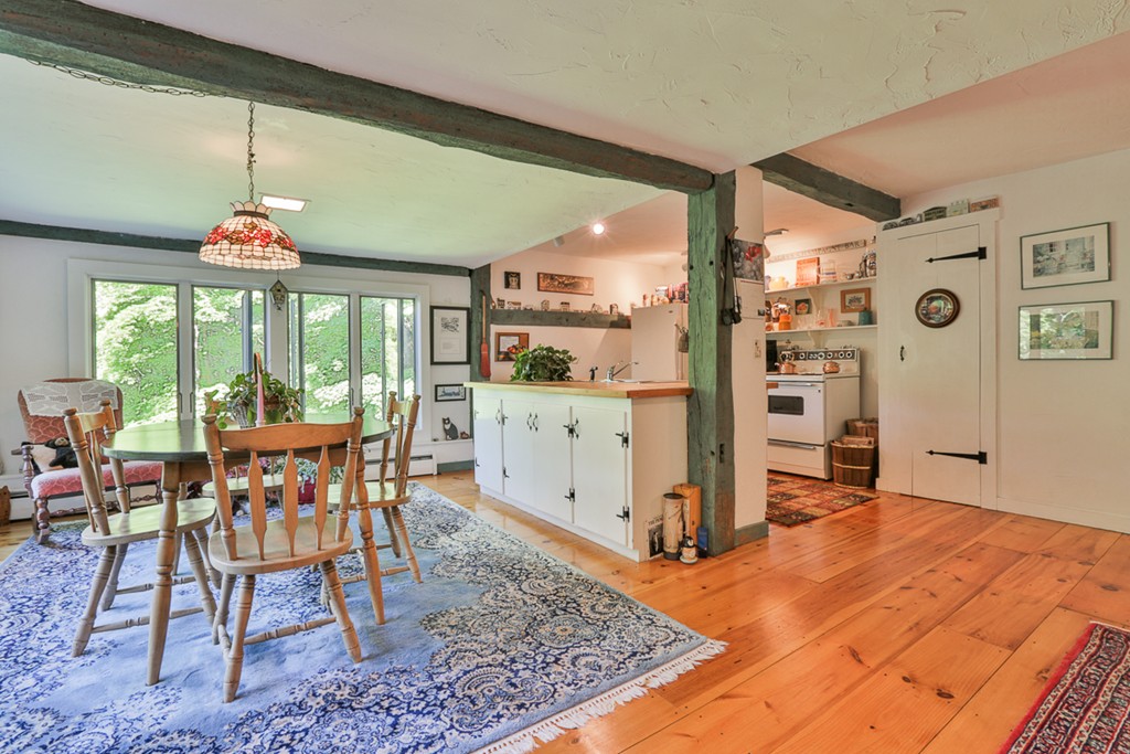 129 Gleason Road Princeton, MA 01541 - Photo 19 of 30 a dining room with furniture a rug and a large window