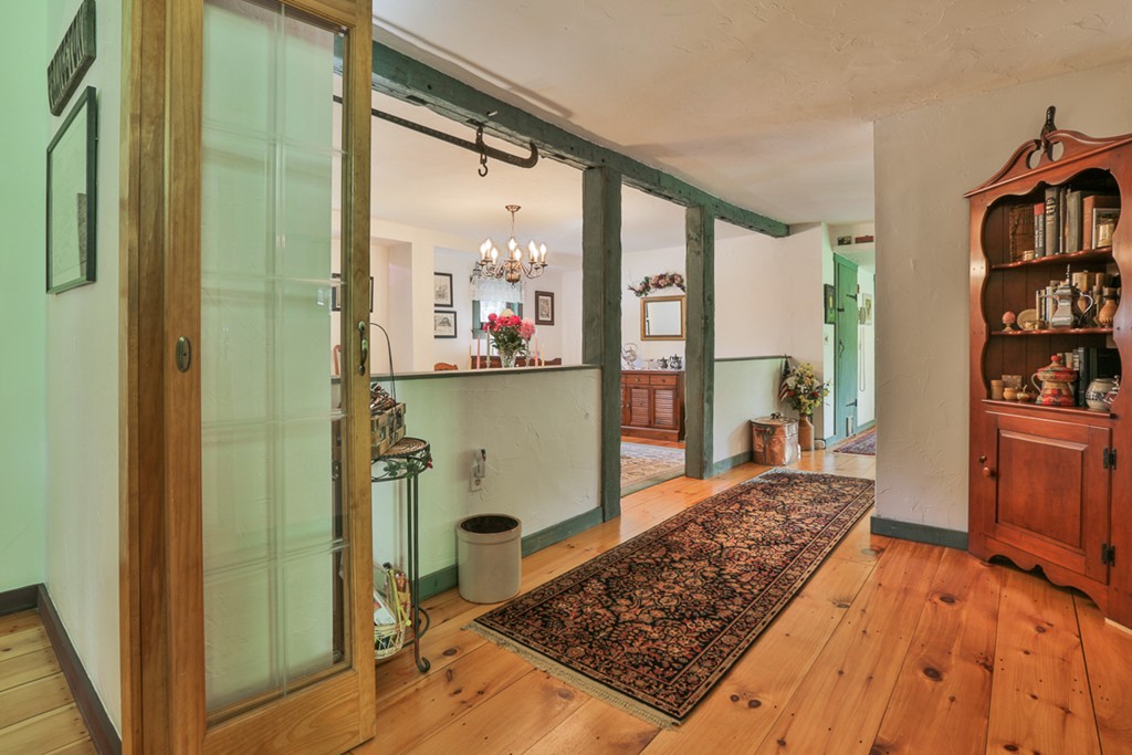 129 Gleason Road Princeton, MA 01541 - Photo 22 of 30 a room with wooden floor and furniture